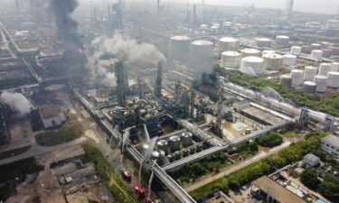 Fire engines and rescue workers at the scene of the fire in Shanghai on Saturday.