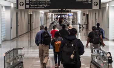 Travelers walk into US customs at Hartsfield-Jackson International Airport in Atlanta. The Transportation Security Administration has started an investigation after an official said a gun may have been missed during a security check at Hartsfield-Jackson Atlanta International Airport.