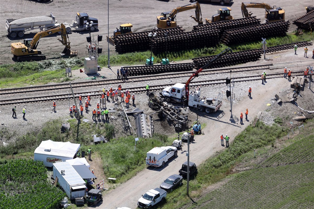 <i>mpi34/MediaPunch /IPX/AP</i><br/>Members of the National Transportation Safety Board arrive to investigate Monday's Amtrak Derailment after the train struck a dump truck at an uncontrolled crossing in Mendon