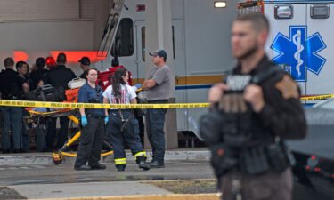 Emergency personnel gather after a deadly shooting Sunday