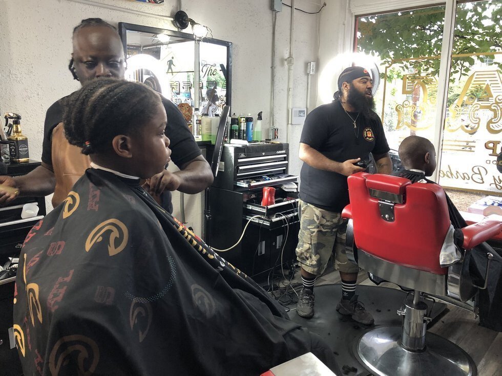 <i>WGCL</i><br/>The Witherite Law Group and V-103 teamed up with Rapper Killer Mike's barbershops to get Fulton and DeKalb County kids ready for their first day of school on Monday.