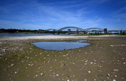 A puddle of water in the nearly dried-up river bed of the Rhine in Cologne