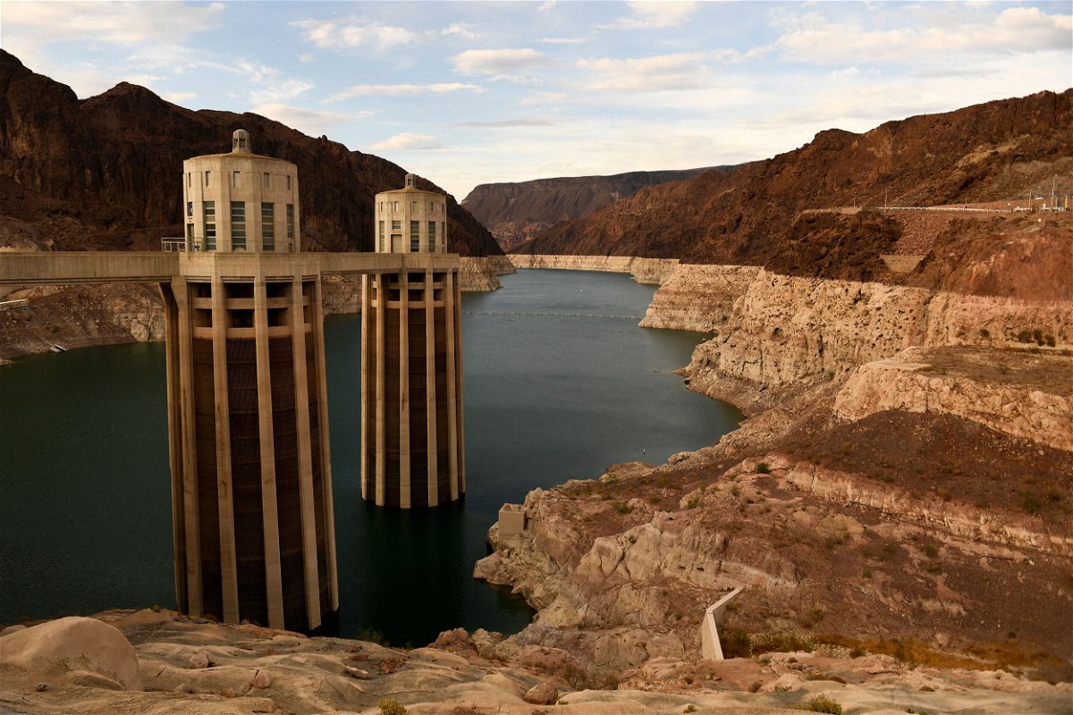 <i>Patrick T. Fallon/AFP/Getty Images</i><br/>Intake towers for water to enter to generate electricity and provide hydroelectric power stand during low water levels due the western drought in July of 2021 at the Hoover Dam.