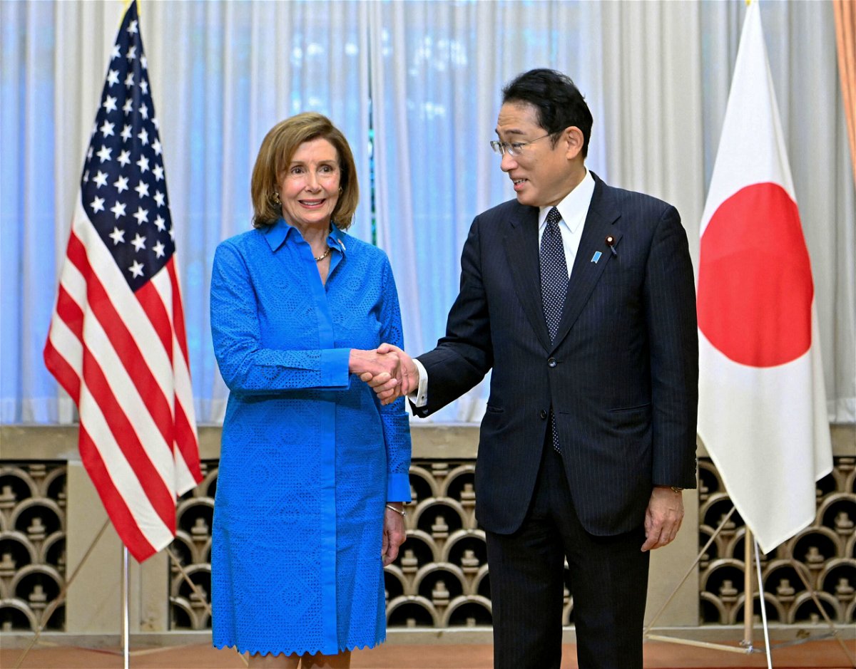 <i>Kyodo/Reuters</i><br/>House Speaker Nancy Pelosi shakes hands with Japan's Prime Minister Fumio Kishida in Tokyo on August 5.