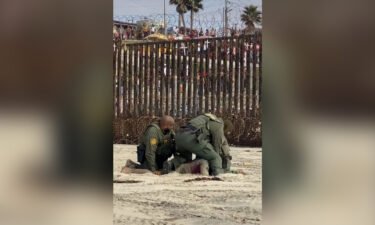 An altercation involving United States Border Patrol agents and two migrants on a Southern California beach was captured on video