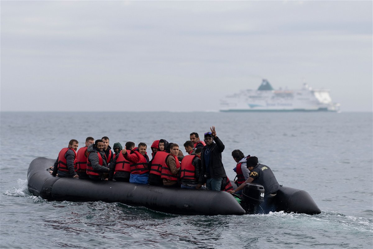 <i>Dan Kitwood/Getty Images/FILE</i><br/>An inflatable craft carrying migrants crosses the shipping lane in the English Channel on August 4 off the coast of Dover