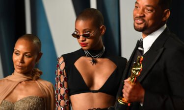 Willow Smith (center) is pictured with Will Smith and Jada Pinkett Smith. Willow Smith says she was not fazed by the media firestorm that broke out after her father