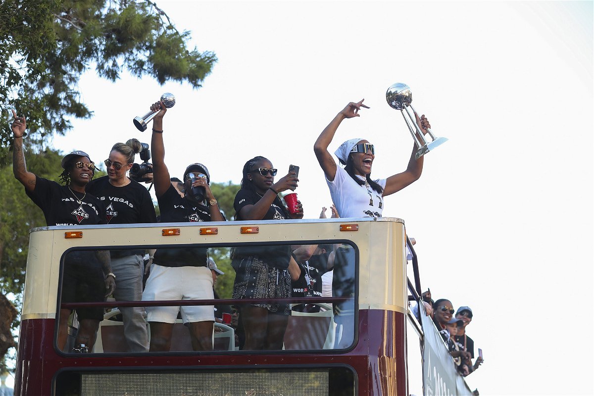 <i>Zak Krill/Getty Images</i><br/>The Las Vegas Aces celebrate their WNBA championship with an open-topped bus parade in front of thousands of fans on the Las Vegas Strip on Tuesday