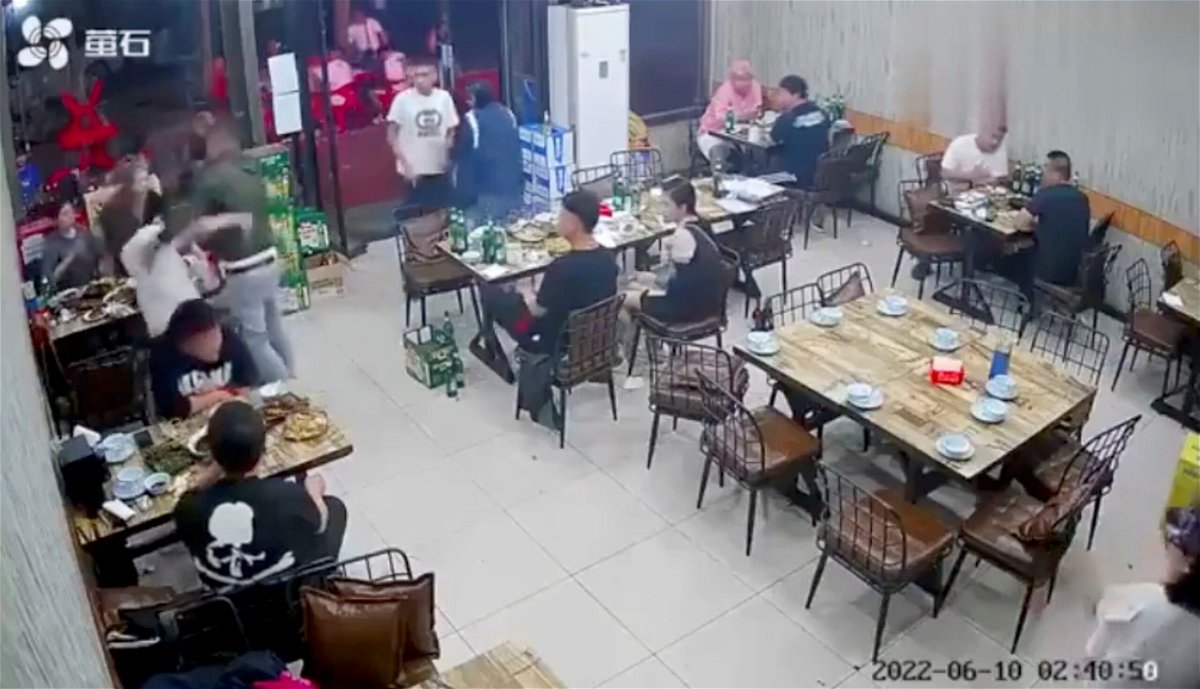 <i>Reuters</i><br/>Video footage shows a man assaulting a woman at a restaurant in the Chinese city of Tangshan.