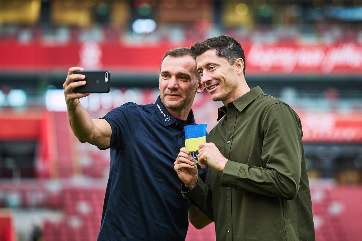 <i>Joosep Martinson/Getty Images</i><br/>Poland captain Robert Lewandowski (right) received a Ukraine armband from Andriy Shevchenko.