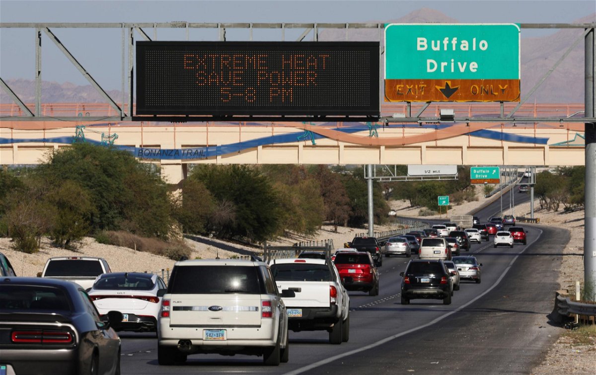 <i>Ethan Miller/Getty Images</i><br/>A digital road sign on Summerlin Parkway displays a message asking motorists to save power due to extreme heat conditions on September 7 in Las Vegas.