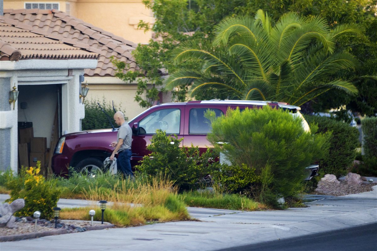 <i>Benjamin Hager/AP</i><br/>Clark County Public Administrator Robert Telles washes his car outside his home in Las Vegas on September 6.