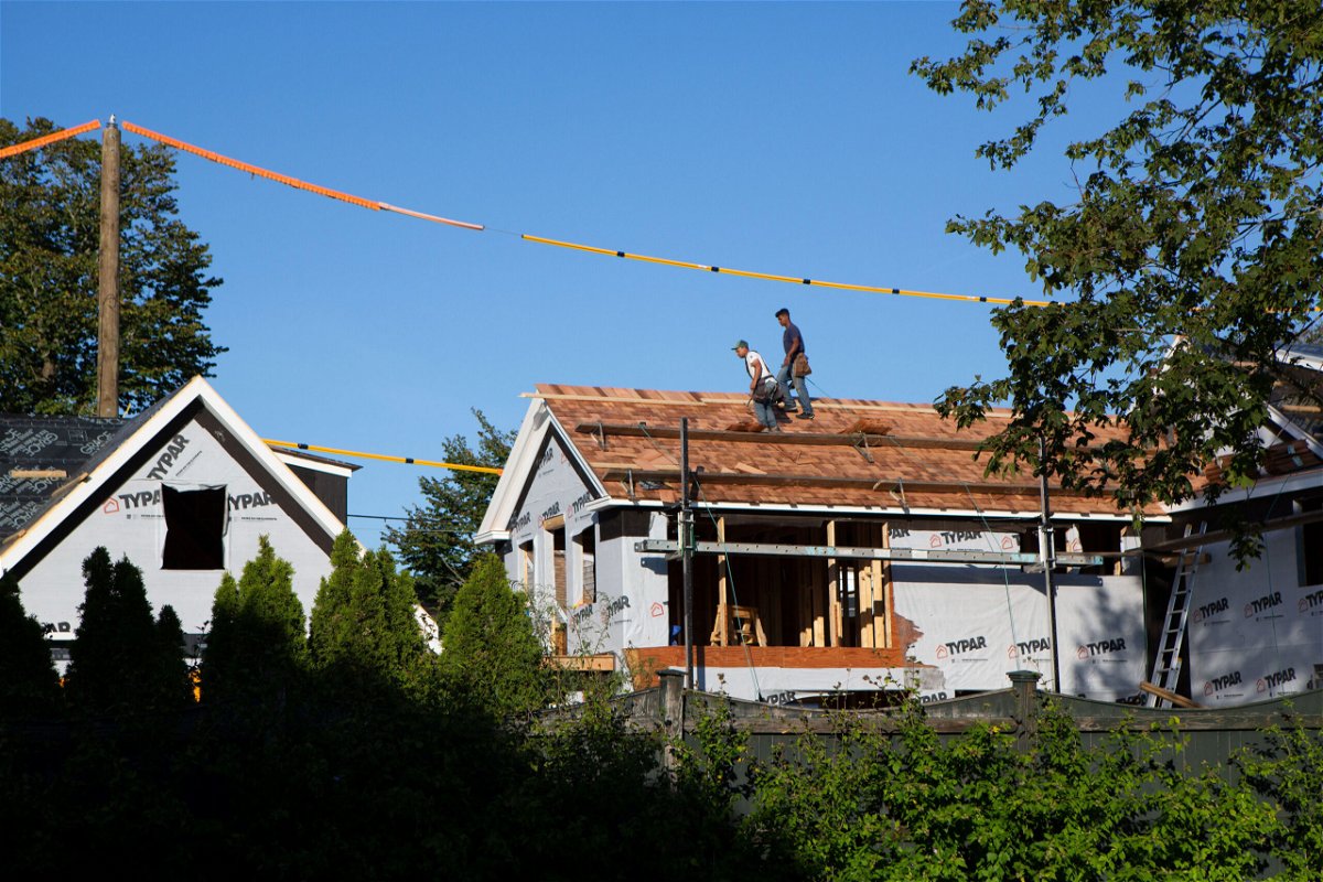 <i>Erica Lee/CNN</i><br/>Workers behind St. Andrew's help build a house in Edgartown. Franklin Pierre