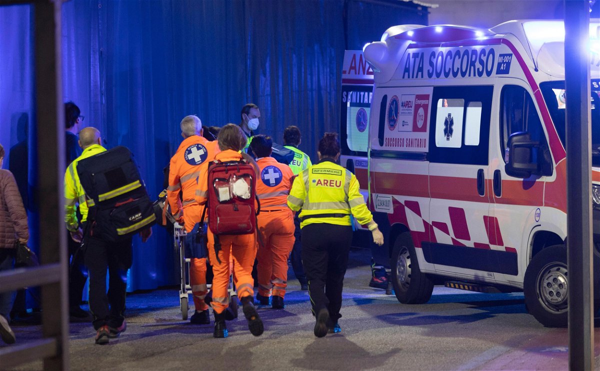 <i>LaPresse/AP</i><br/>Medics wheel an injured person into an ambulance at the scene of an attack in Milan