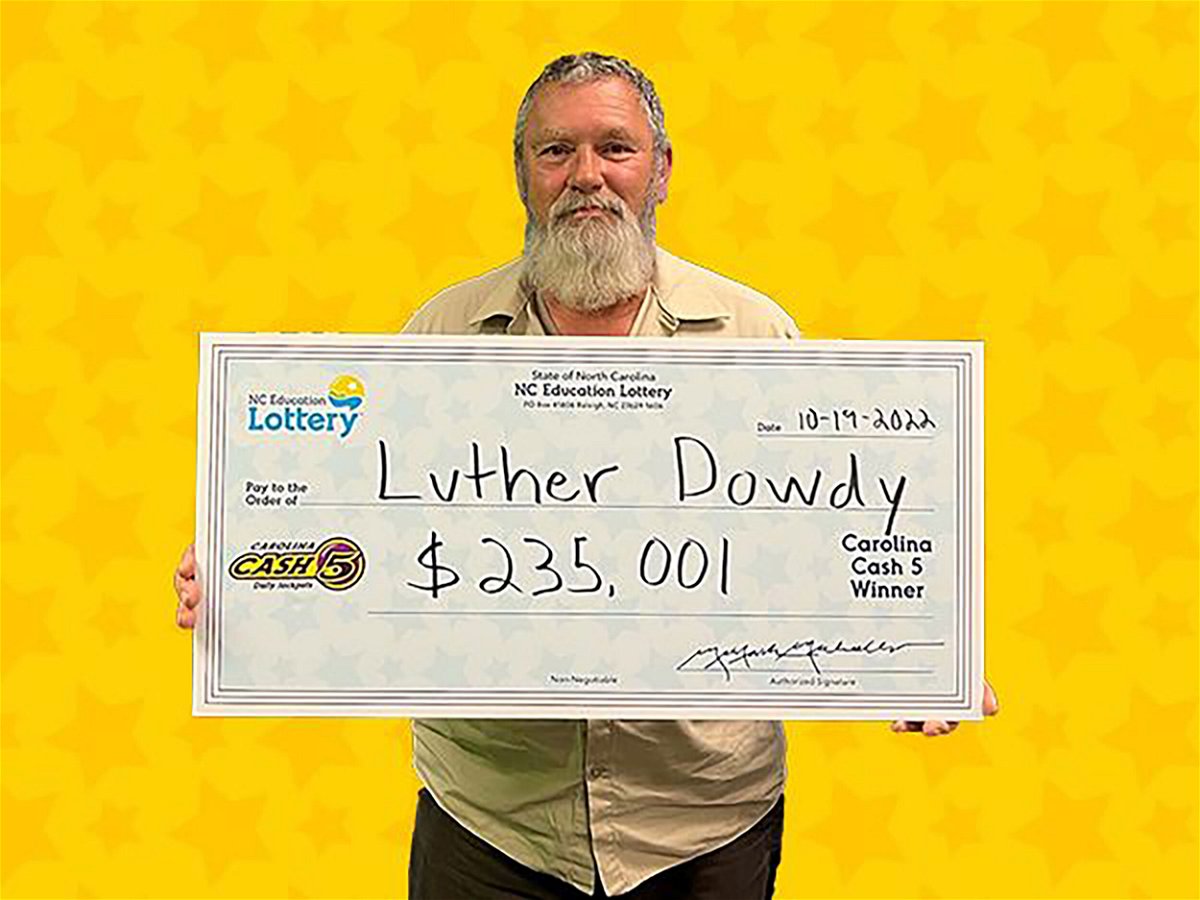 <i>Courtesy NC Education Lottery</i><br/>NASCAR fan Luther Dowdy of Lincolnton bought three $1 Cash 5 tickets in tribute to Dale Earnhardt and won a $235
