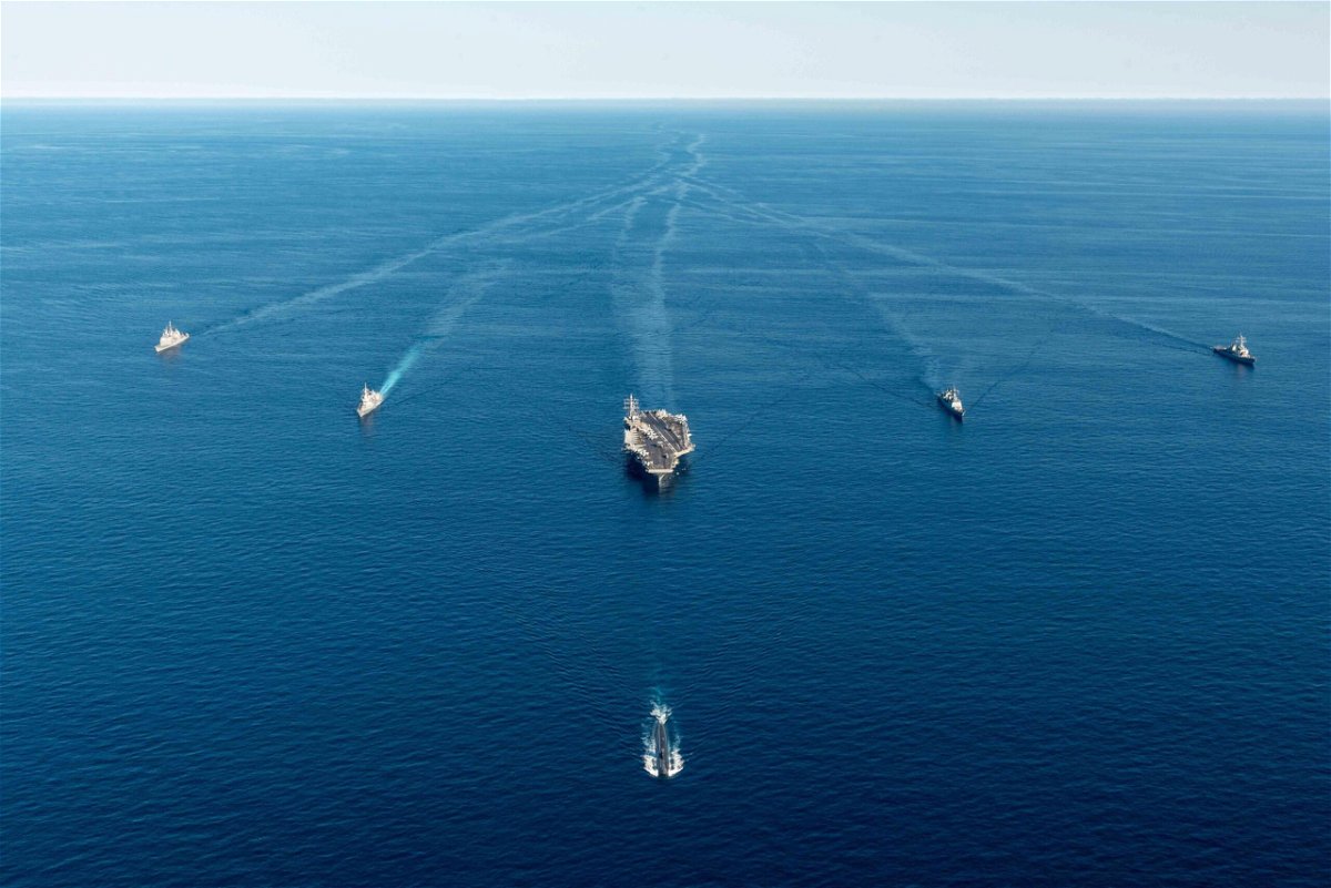 <i>Handout/Getty Images</i><br/>A US aircraft carrier and submarine