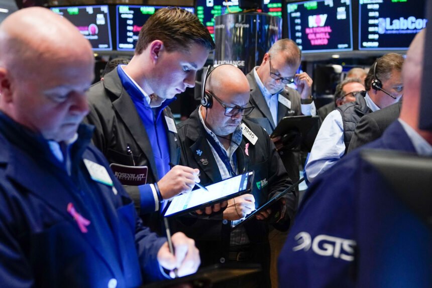 Big bank earnings are coming Friday. Traders are seen here at the New York Stock Exchange in New York