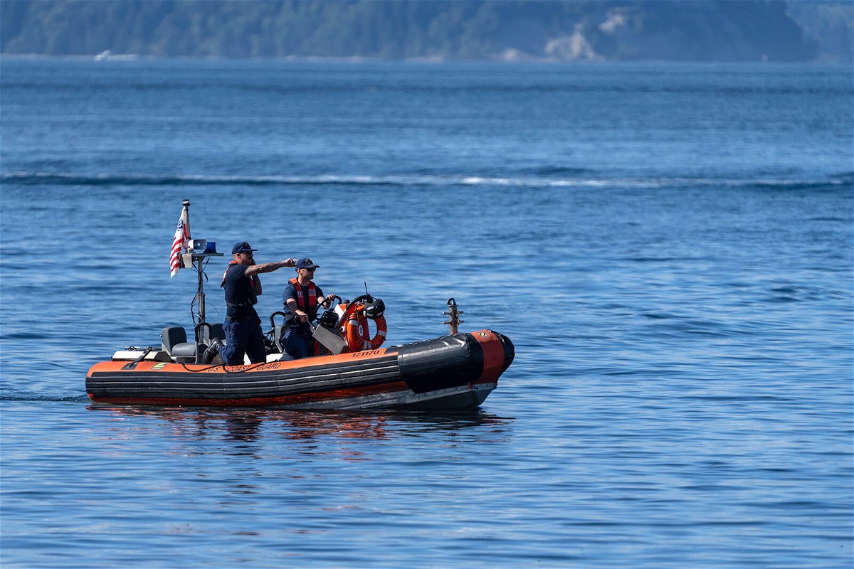 <i>Stephen Brashear/AP</i><br/>Federal investigators are asking the manufacturer of a seaplane that plunged into a Washington state bay to mandate inspections of the plane's tail section. A U.S. Coast Guard boat is seen here searching near Whidbey Island