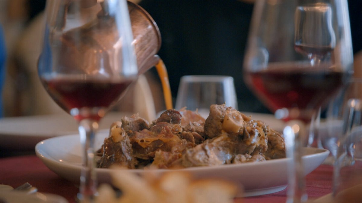 <i>CNN</i><br/>Chef Pino Trimbol pours the juices from the lamb over the home-style Calabrian dish.