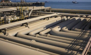 Oil pipelines sit on the quayside beside the Arabian Sea in Saudi Aramco's Ras Tanura oil refinery and oil terminal in Ras Tanura