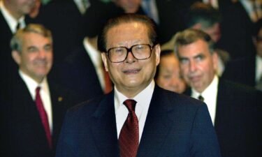 Chinese leader Jiang Zemin smiles during a meeting with  executives at the Fortune Global Forum in Hong Kong on May 8