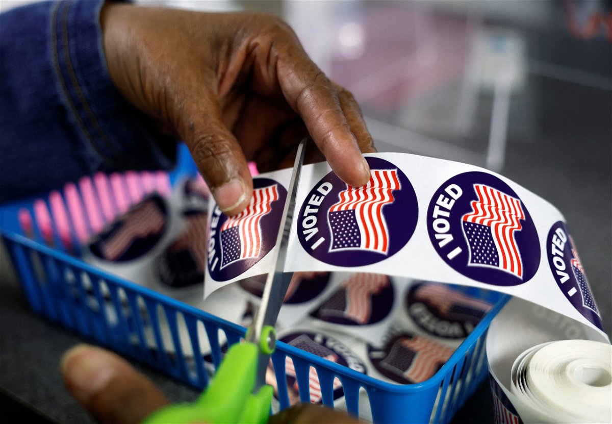 <i>Evelyn Hockstein/Reuters</i><br/>A poll worker prepares 