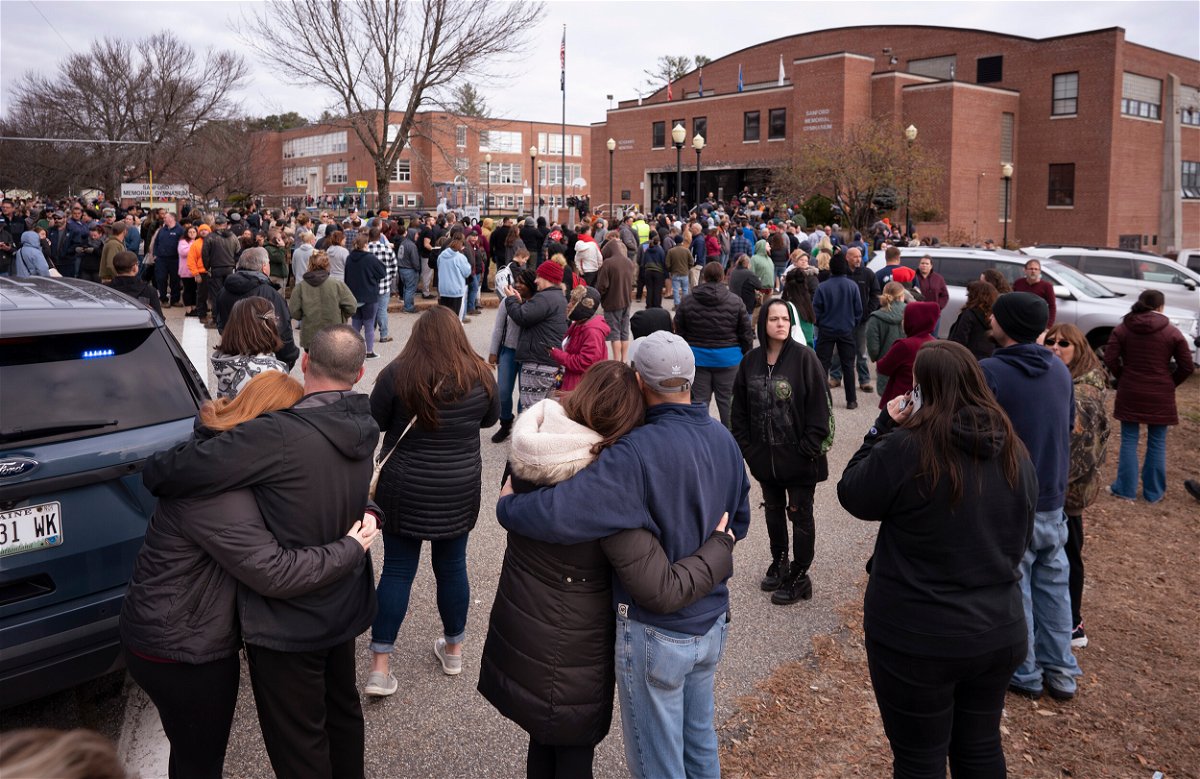 <i>Gregory Rec/Portland Press Herald/Getty Images</i><br/>Parents wait to pick up students after an active shooter report at Sanford High School in Maine on Tuesday.
