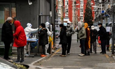 Residents undergo swab testing at a residential area under lockdown due to Covid-19 restrictions in Beijing on November 29.