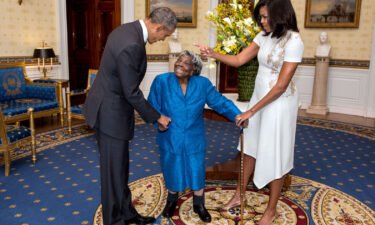 President Barack Obama and First Lady Michelle Obama greet 106-Year-Old Virginia McLaurin in the Blue Room of the White House prior to a reception celebrating African American History Month
