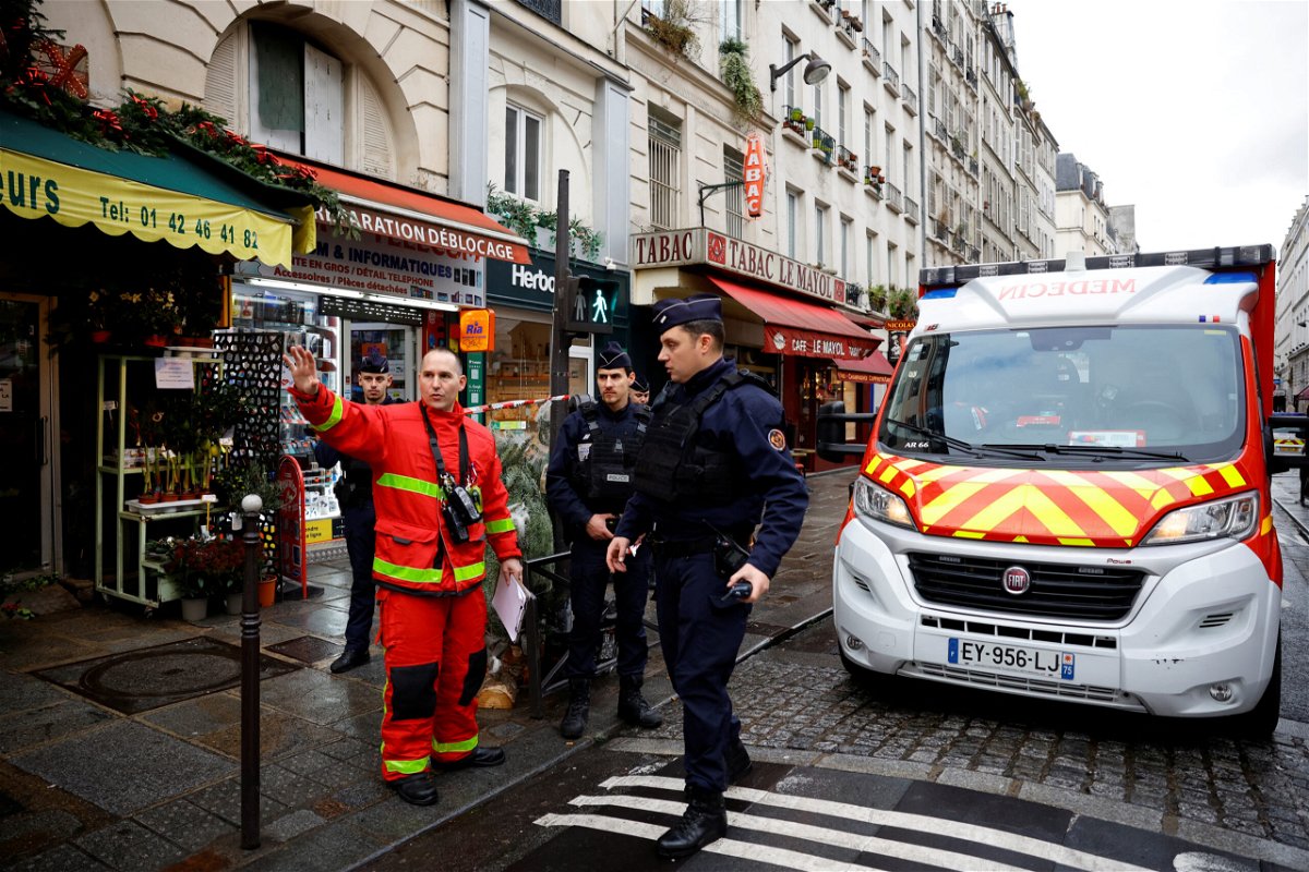 <i>Sarah Meyssonnier/Reuters</i><br/>French police and firefighters secure a street in Paris