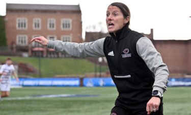Head coach Julianne Sitch of the University of Chicago Maroons directs her team in the final minute of their win against the Williams College Ephs during the Division III Men's Soccer Championship Saturday in Salem