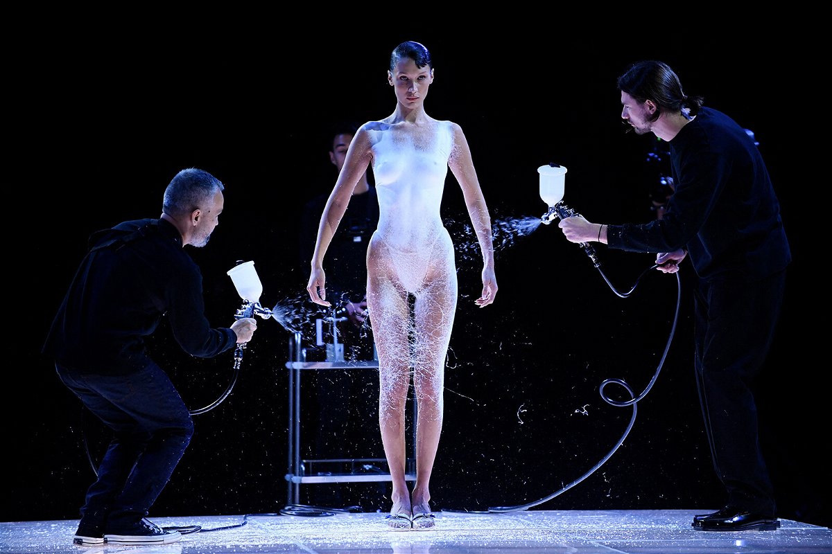 <i>Julien De Rosa/AFP/Getty</i><br/>Bella Hadid's Coperni spray-on dress moment at Paris Fashion Week was named top viral moment of 2022 by fashion search engine Lyst.