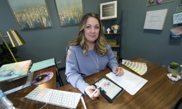 Same-sex marriage fight continues Monday at the Supreme Court with challenge from website designer Lorie Smith - shown in her office on November 7