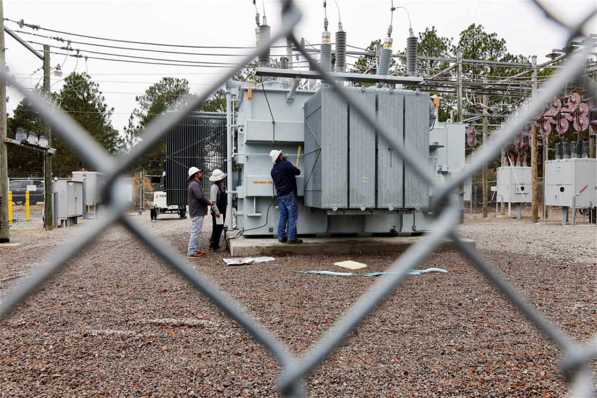 <i>Jonathan Drake/Reuters</i><br/>Duke Energy workers inspect a transformer radiator that they said was damaged by gunfire in Carthage