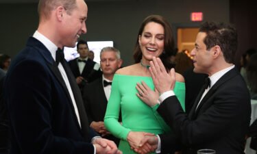 Prince William and Kate chat with actor Rami Malek at the awards.