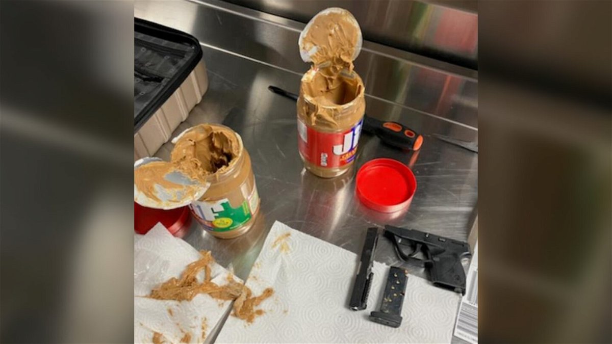 <i>TSA</i><br/>Parts of a disassembled .22 semiautomatic handgun were found hidden in two jars of peanut butter in a traveler's checked luggage.