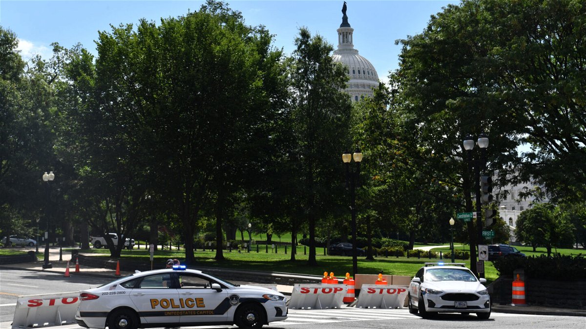 <i>Nicholas Kamm/AFP/Getty Images</i><br/>US Capitol police block a street during an investigation of a possible bomb threat near the US Capitol and Library of Congress in Washington