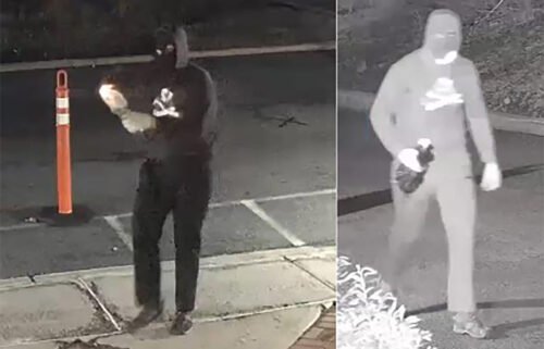 A masked suspect is seen lighting a Molotov cocktail in front of Temple Ner Tamid in a still image from surveillance footage in Bloomfield