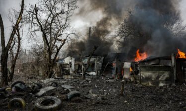Garages are pictured on fire after missile strike on February 2