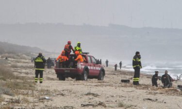 Rescuers arrive at the beach where bodies were found after a migrant shipwreck