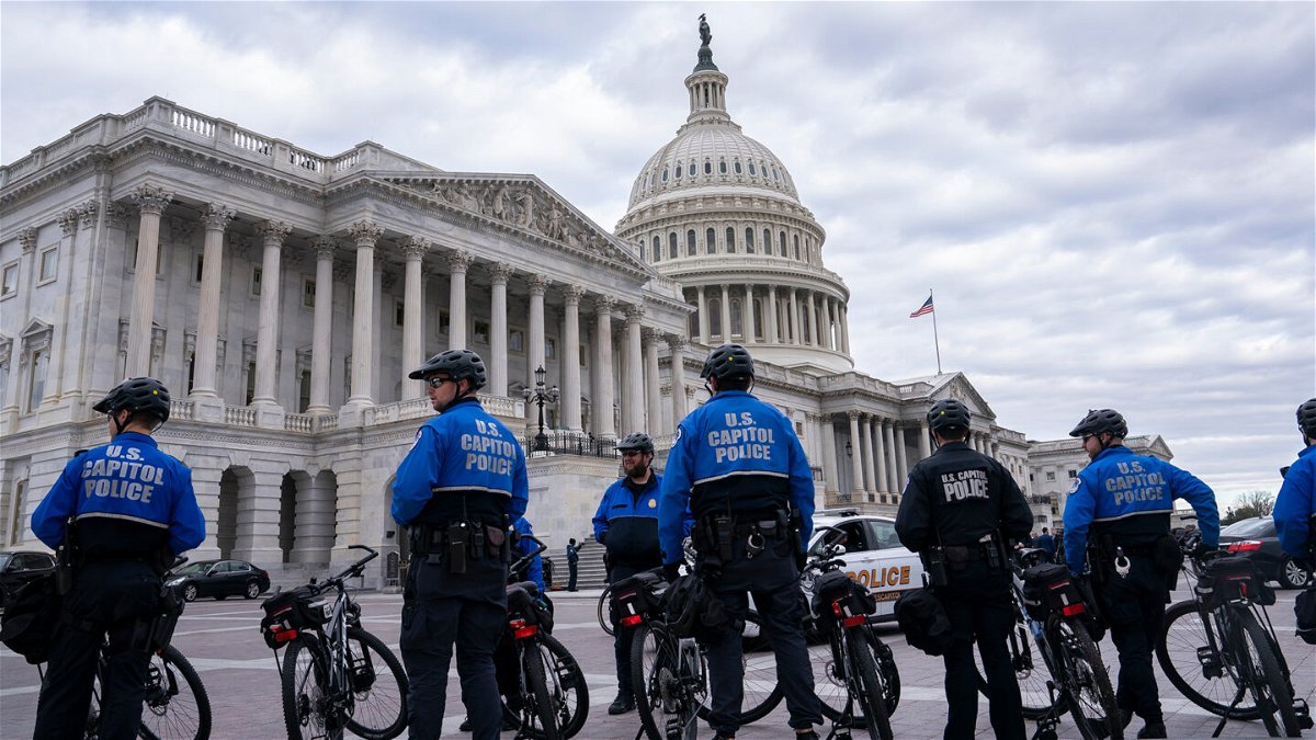 <i>Nathan Howard/Getty Images</i><br/>US Capitol police officers guard the perimeter of the Capitol on January 6 in Washington