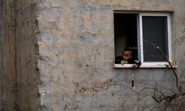 A child plays by a window