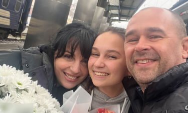 Yeva Hrytsak is surrounded by her parents during her December visit to Dnipro