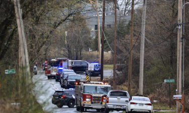 Emergency vehicles appear near the site of a small aircraft crash in Little Rock