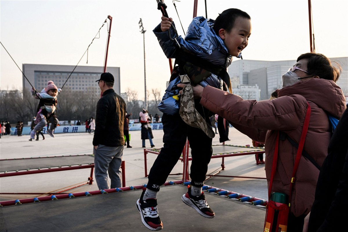 <i>Noel Celis/AFP/Getty Images</i><br/>China is planning to offer free fertility treatment to citizens to boost its record low birth rate. Children jump on trampolines in Beijing on February 5.