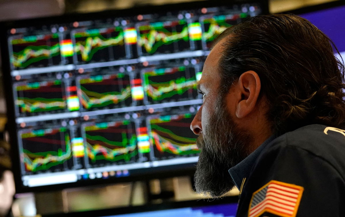 <i>Timothy A. Clary/AFP/Getty Images</i><br/>Traders work on the floor of the New York Stock Exchange on March 14.