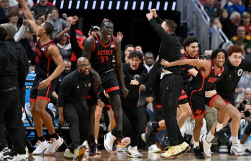 San Diego State Aztecs players celebrate defeating the Alabama Crimson Tide in the men's NCAA tournament third round on March 24 in Louisville