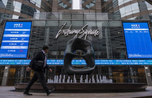 European and Asian markets were mixed on Thursday after the US Fed raised rates by a quarter-point. Pictured is the Hong Kong Stock Exchange on March 13.