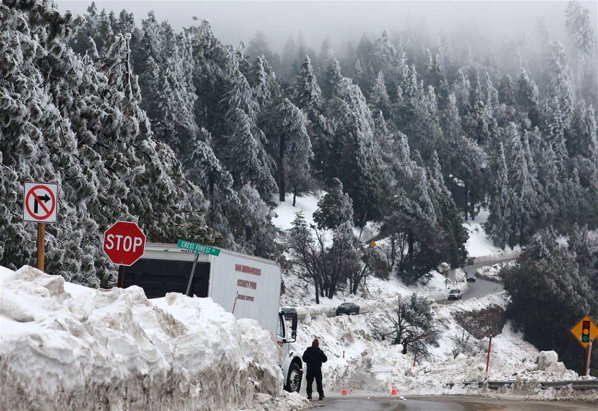 <i>Mario Tama/Getty Images</i><br/>5 things to know for March 8 includes a series of winter storms that dropped more than 100 inches of snow in the San Bernardino Mountains in Southern California on March 6.