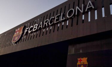 UEFA has opened an investigation into the 'Caso Negreira.' This image shows the logo of FC Barcelona on the facade of the Camp Nou stadium in Barcelona in 2021.